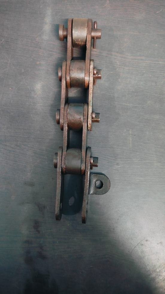 Chain roller link with welded attachment lug