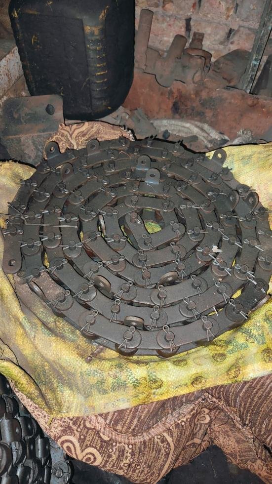 Reconditioned carrier chain coiled in the workshop